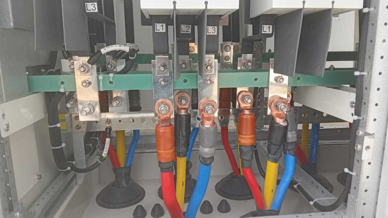 Electrical busbar and power cable connections inside the solar distribution cabinet