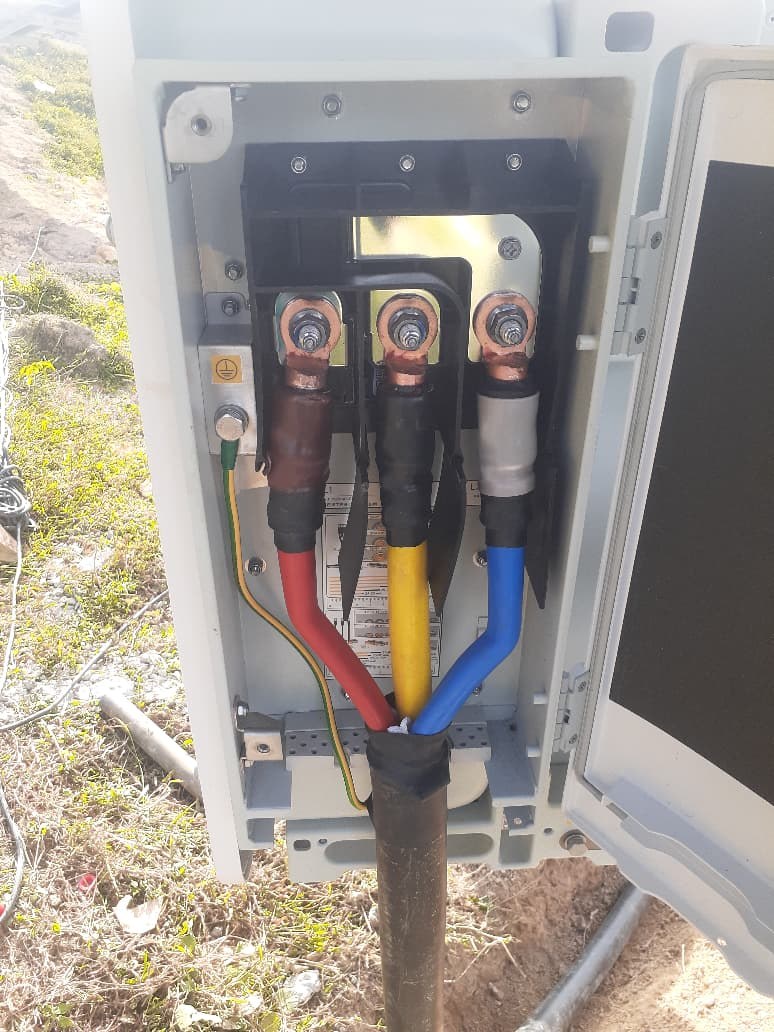 Three-phase power cable terminations inside the Rathgama Solar electrical cabinet