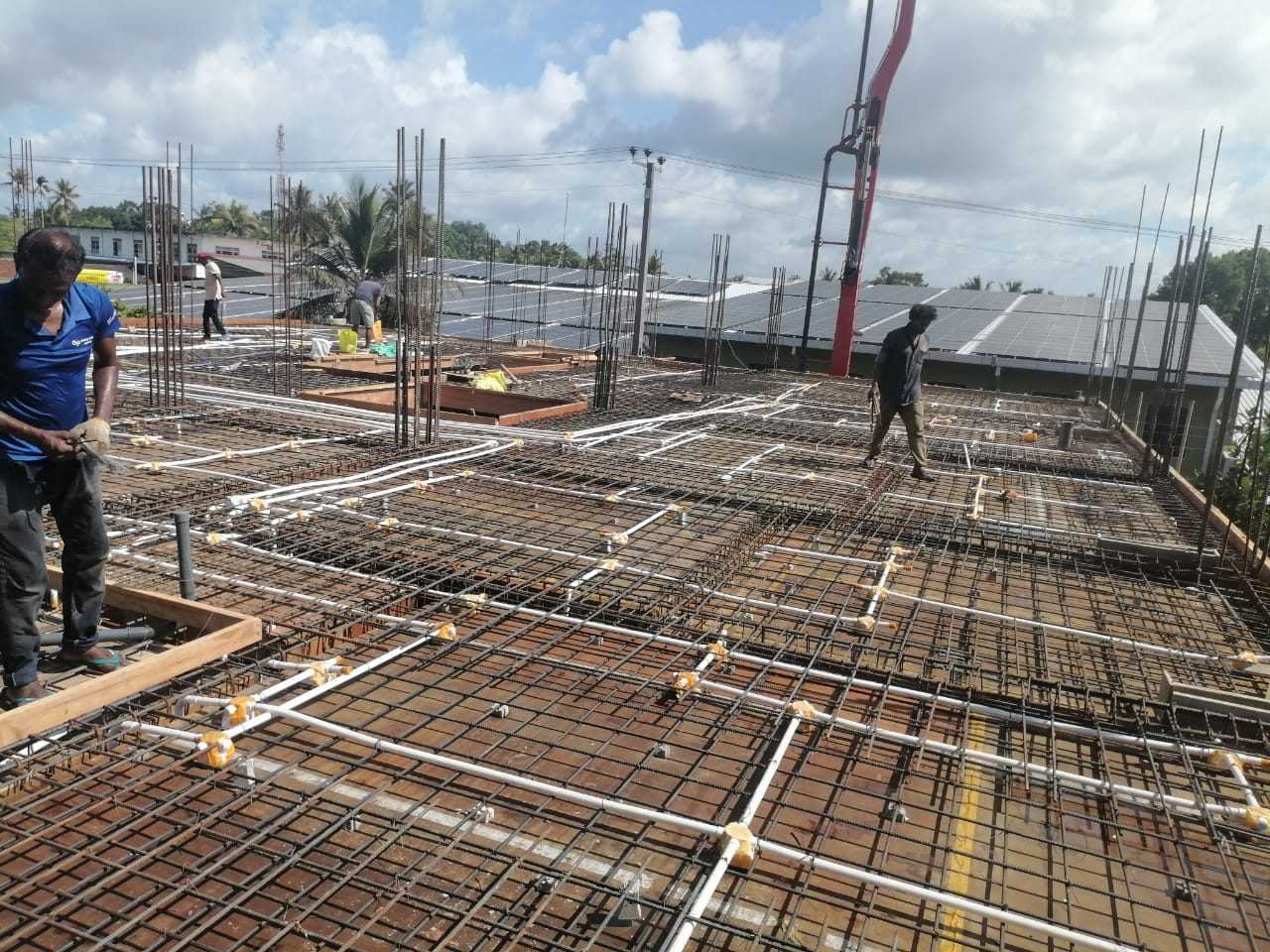 Trillium Apartment construction site showing slab reinforcement and electrical conduits