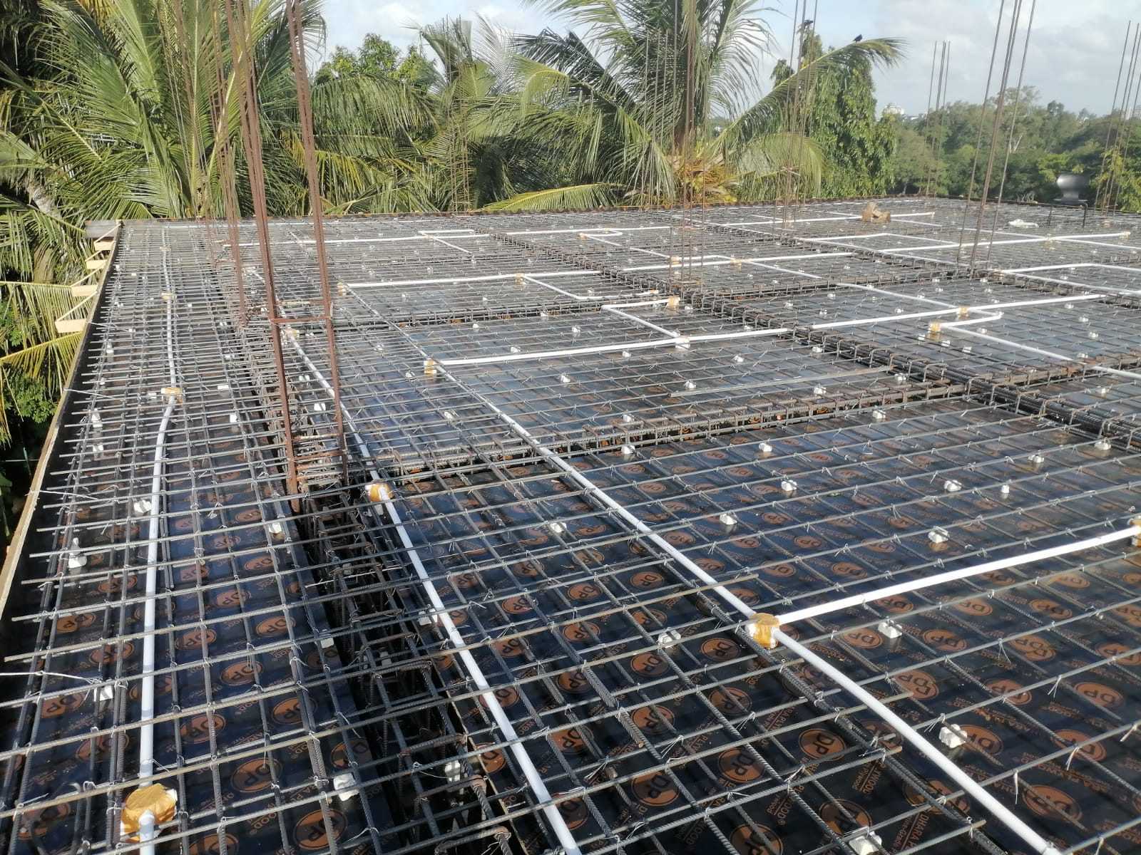 Wide view of apartment slab reinforcement and embedded conduit routes