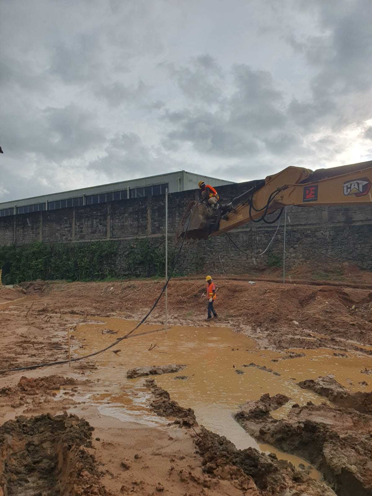 Excavation work and site crew beside the boundary wall at Wagawaththa