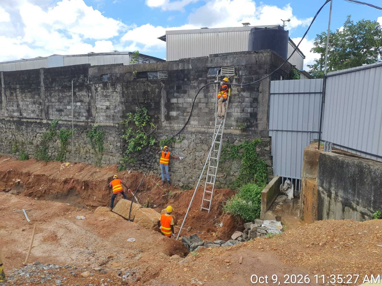 Workers carrying out trench-side site work at Wagawaththa