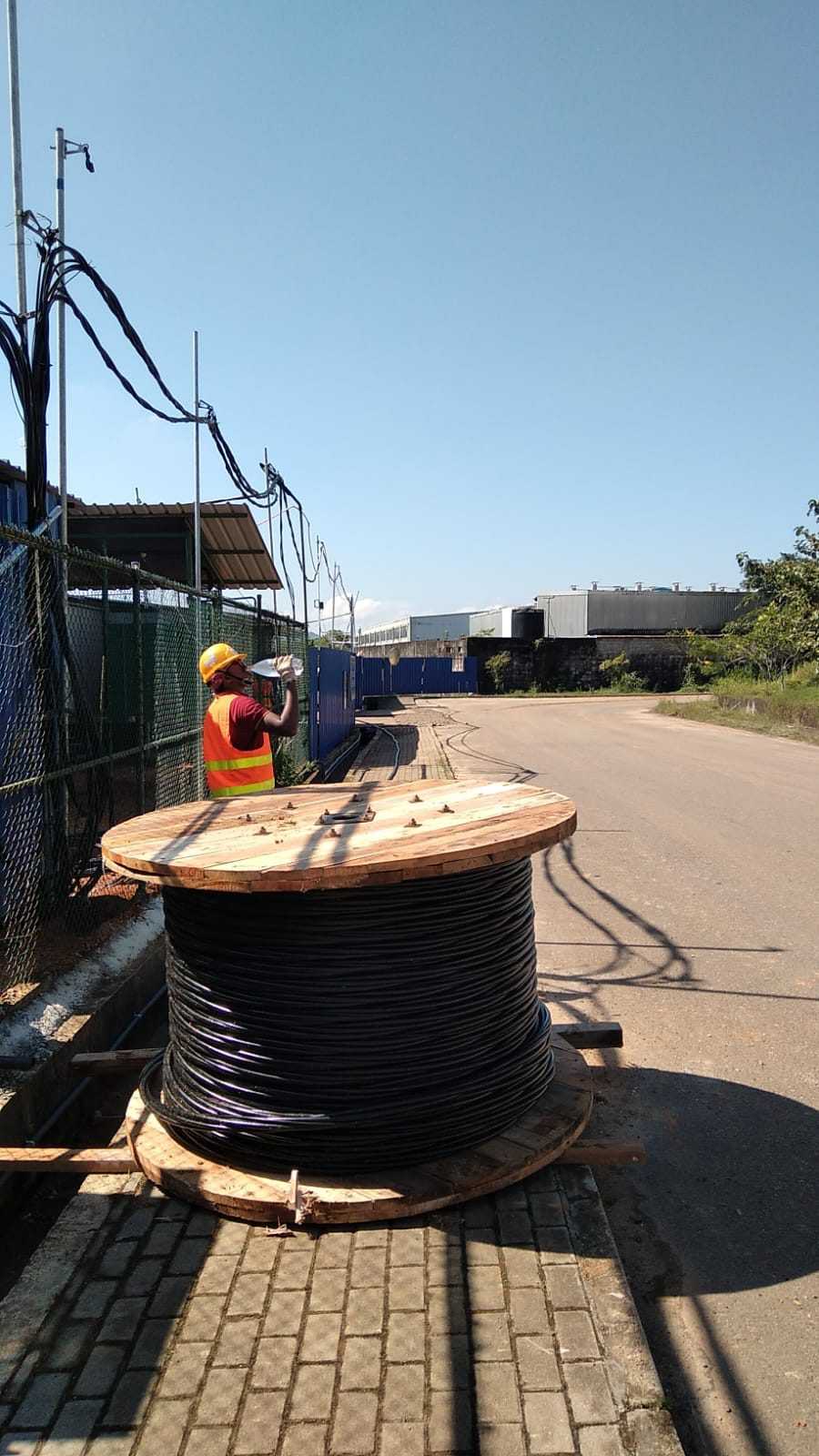Cable drum and site worker at the Wagawaththa project site